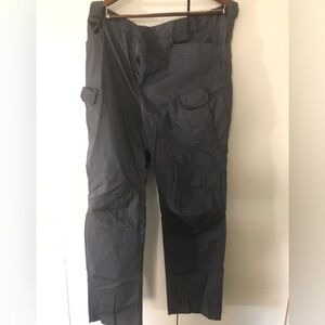 Factory made many utility pockets good condition slim fitting cargo